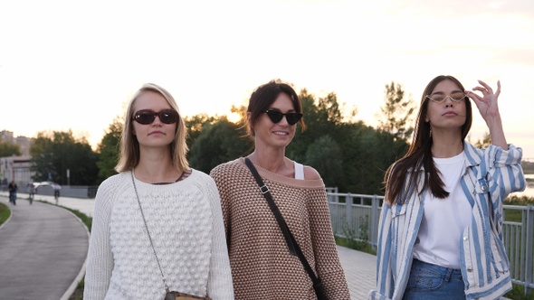 Serious Young Women with Glasses Walking.