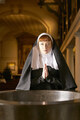 nun in church praying in font - PhotoDune Item for Sale