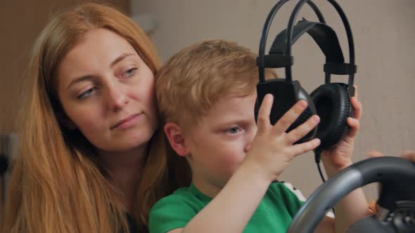 Son With Mother Playing Computer Game