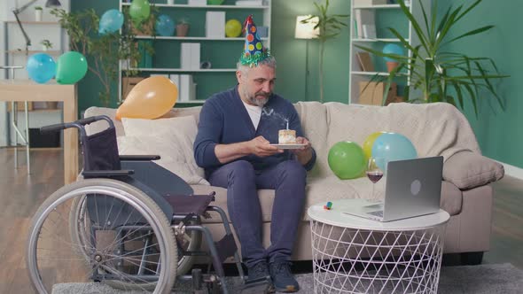 A Happy Elderly Man with a Disability Celebrating His Birthday Online