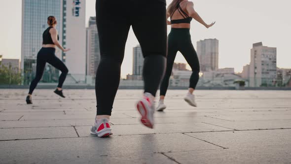 Low Angle View of Sporty Women Dancing Together on the City Street