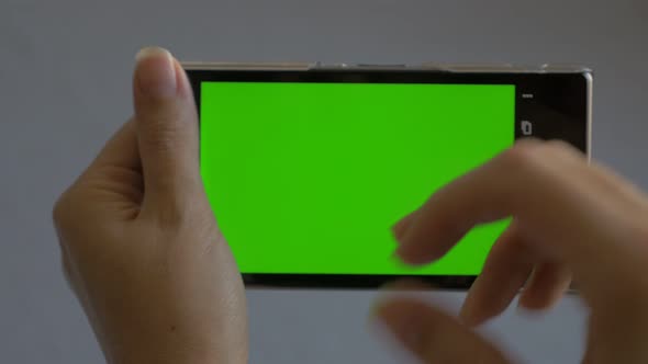 Mobile phone green screen  background 4K UHD 2160p footage - Smart phone using green screen backgrou