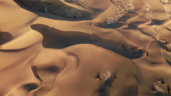 Topdown View on the Amazing Wavy Patterns on the Desert Earth Road Trip