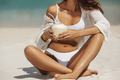 Tanned Woman in Bikini with Coconut on the Beach - PhotoDune Item for Sale