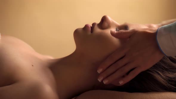 Beautiful Woman Having a Facial Massage