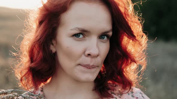 Portrait of a Beautiful Redhead Girl at Sunset