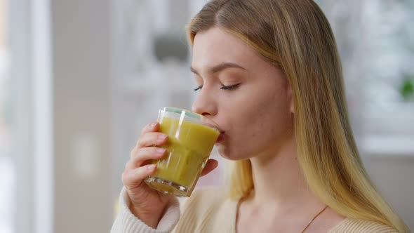 Closeup Portrait of Happy Slim Beautiful Woman Drinking Vitamin Fruit Smoothie Indoors