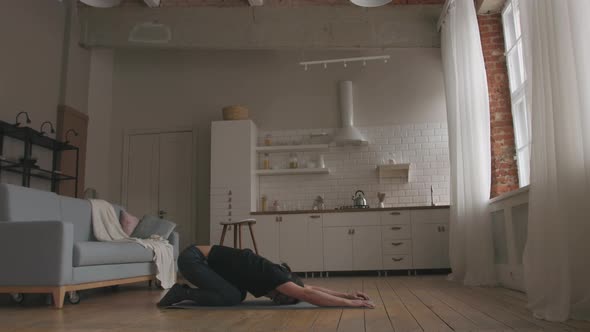 Man Practicing Yoga at home