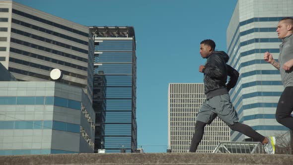 Slow motion shot of people running in city, shot on Phantom Flex 4K alt