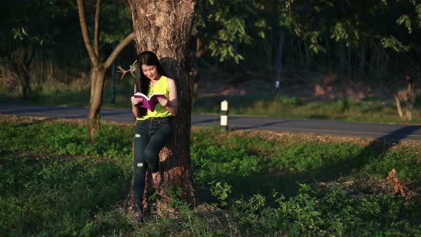 woman reading a book in the garden