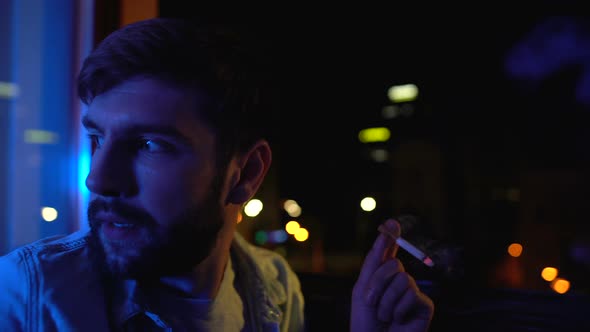 Depressed Man Nervously Smoking Near Window at Night, Life Decision, Problems