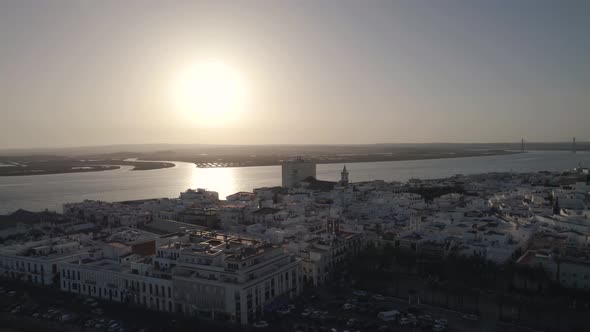 Aerial panorama view Ayamonte downtown Coastline, Sun reflections on Guadiana river