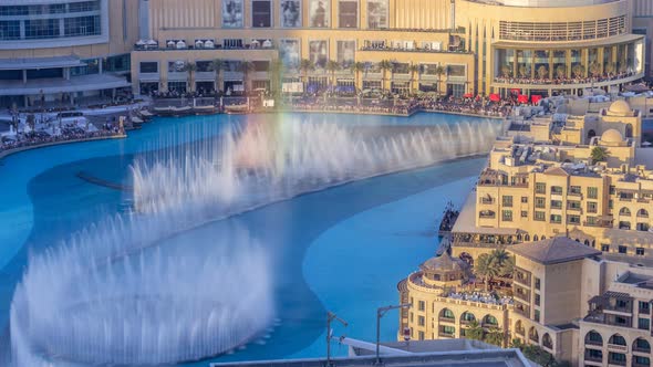 Evening Aerial View Dancing Fountains Downtown and in a Manmade Lake Timelapse in Dubai UAE