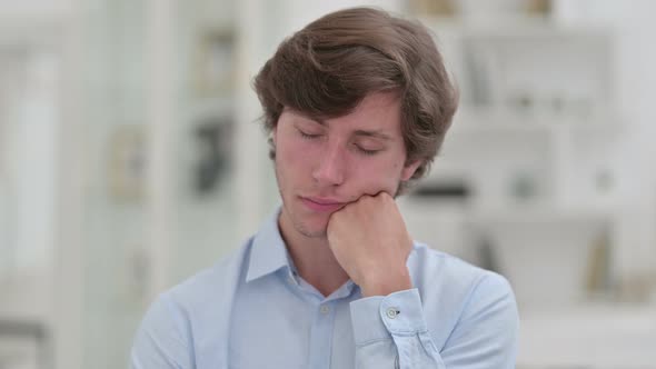 Sleepy Casual Young Man Taking Nap 