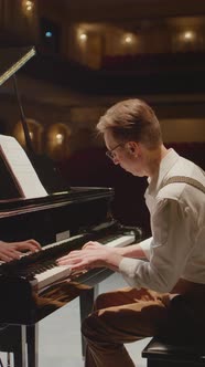 Vertical Shot of Pianist Playing Music on Stage