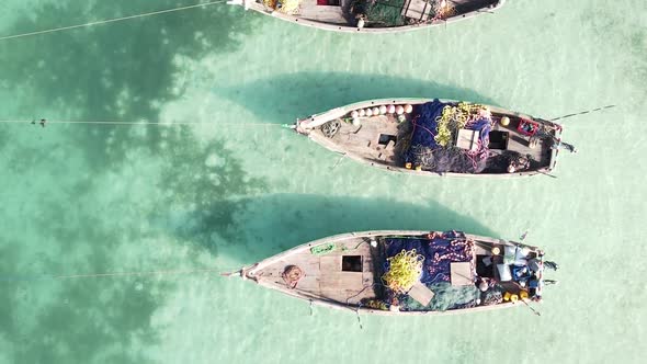 Vertical Video Boats in the Ocean Near the Coast of Zanzibar Tanzania Aerial View