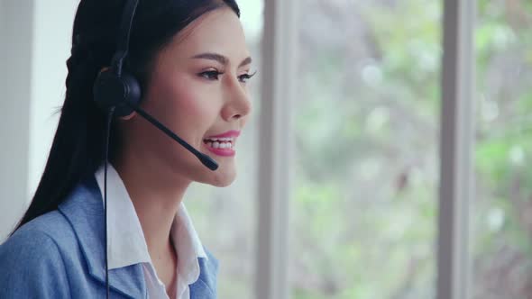 Customer Support Agent or Call Center with Headset Talking to Customer on Phone