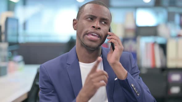 Portrait of African Businessman Talking on Smartphone