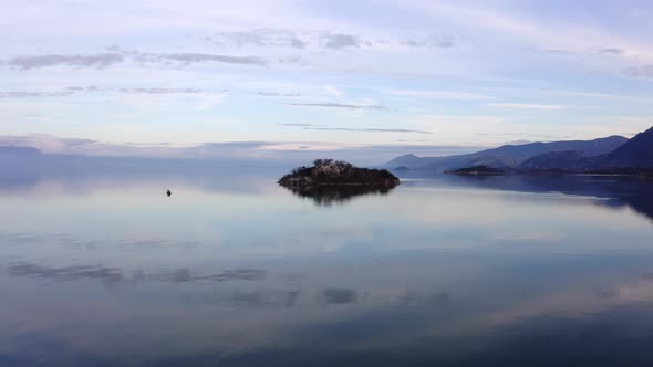 beautiful view of sky reflected on calm Lake Skadar surface at morning hour