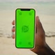 Man Hand Hold White Mobile Phone with Beautiful Fresh Sea and Blue Sky in the Background - VideoHive Item for Sale