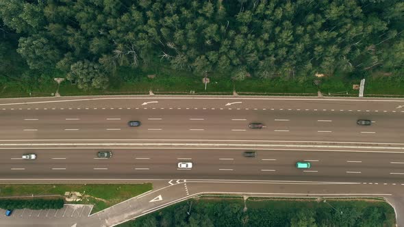 Traffic of Cars and Trucks on the Major Sixlane Freeway in Summer Day  Top View Shot