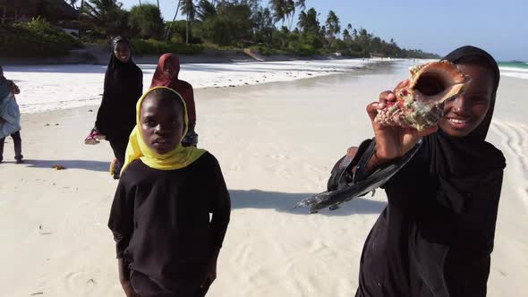 A Group of African Children Extort Money on a Beach in Zanzibar Africa