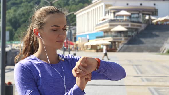 Woman Looks at Watches and Then Runs Away