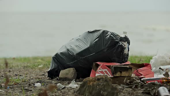 Huge Plastic Bags of Rubbish on Shore People Neglecting Environmental Dangers