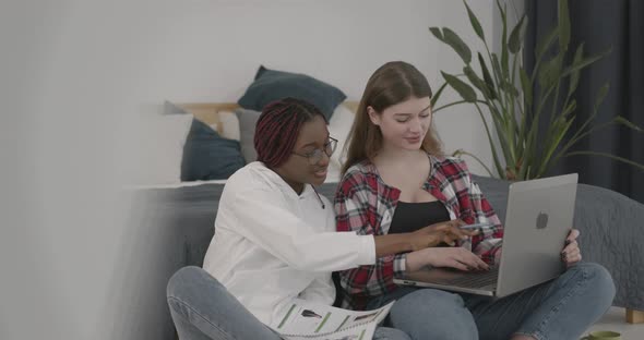 Multi Ethnic Girls Studying Together at Home