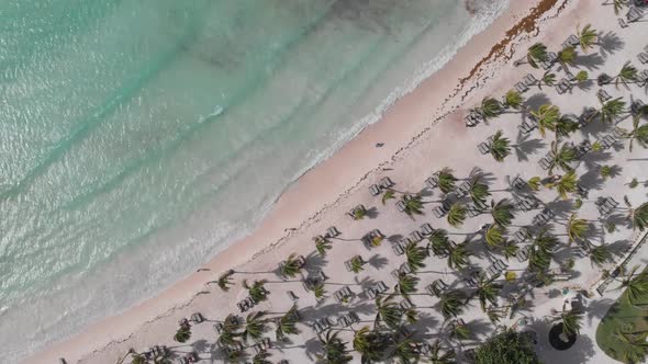 Downward slow circling aerial of the tropical haven of Riviera Maya, México.  Sparkling crystal clea