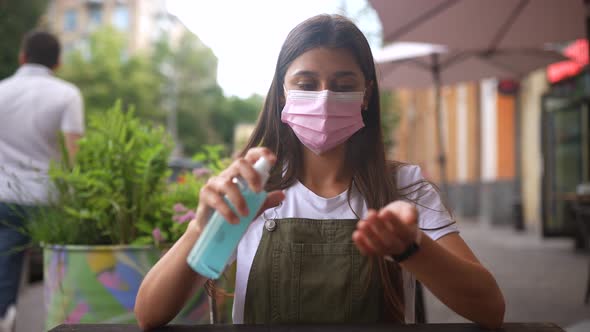 Young Woman Spraying Hand Sanitizer Antiseptic in While Quarantine Close Up