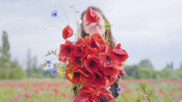 Portrait Pretty Adorable Young Woman Holding Bouquet of Flowers in Hands Looking in the Camera