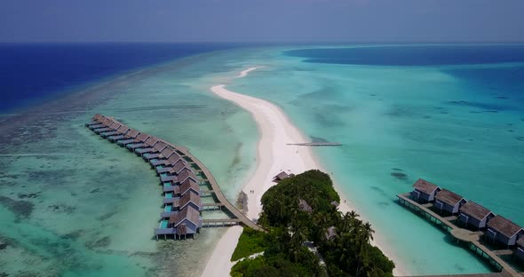 Wide angle above travel shot of a summer white paradise sand beach and turquoise sea background in high res