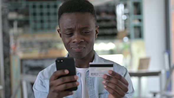 Online Payment Failure on Phone by African Man