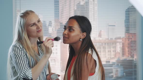 Backstage of Professional Photo Shoot: Make-up Artist Applying Makeup on Attractive Mixed-race Model