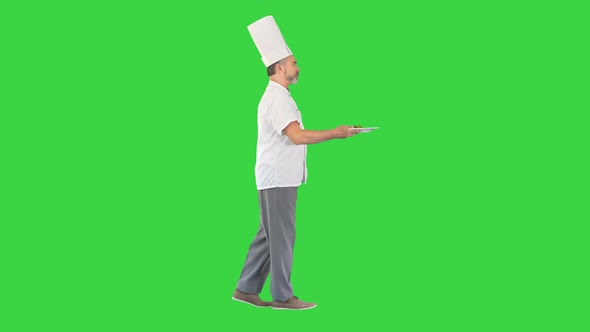 Chef Walking Fast with Pizza on a Green Screen Chroma Key