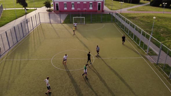 Aerial Footage of a Mini-football Match in an Artificial Open Area in the City's Sports Complex