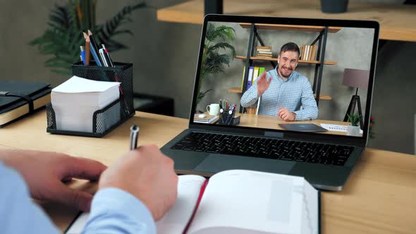 Businessman Writes in Notebook Listen Teacher Study Watch Online Webinar Laptop