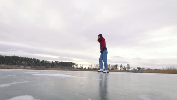 Dexterous Young Woman Is Skating on Ice in Nature. White Skates Are Great for Winter Fun