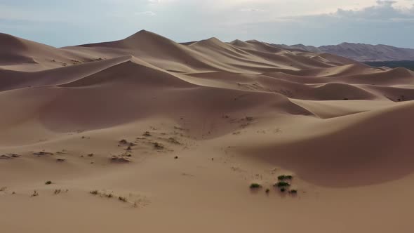 Aerial View of Sand Dunes in Desert at Sunset