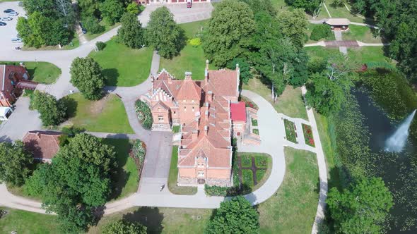 Jaunmoku Brick Medieval Castle Near Tukums, Latvia  Aerial Dron 4k Shot Jaunmokas Manor Park.