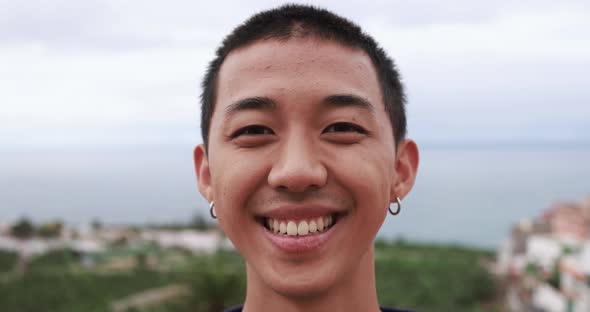 Young asian boy smiling on camera