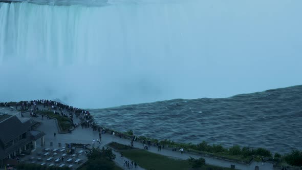 Evening close-up timelapse shot of people gathering near the edge of Horseshoe Falls in Niagara Fall