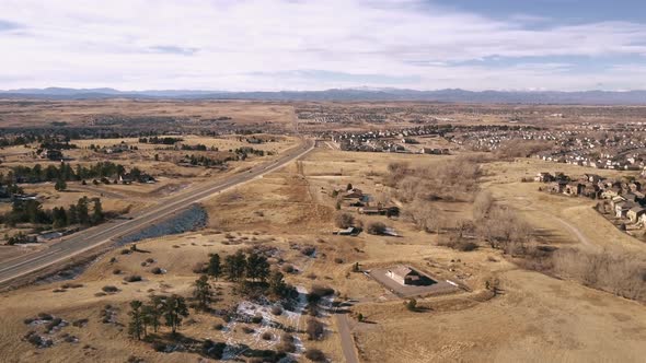 Aerial view of suburban open space park in snowless Winter