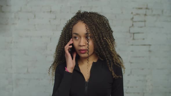 Portrait of Irritated Woman Talking on Smart Phone