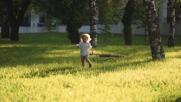 a small two-year-old child, runs to a meeting with a parent