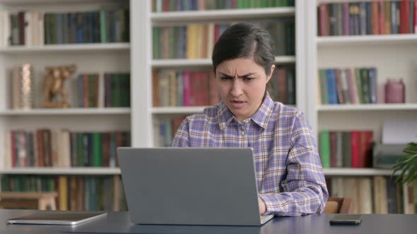 Indian Woman Reacting to Loss While using Laptop