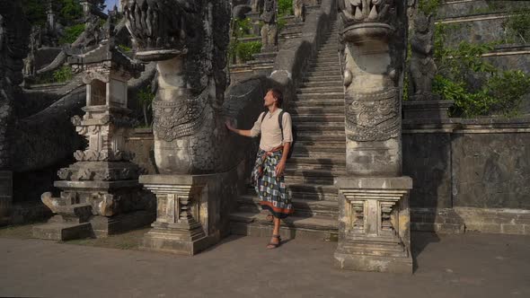 Slowmotion Shot of a Man Tourist Visiting the Pura Lempuyang Temple at the Bali Island, Indonesia