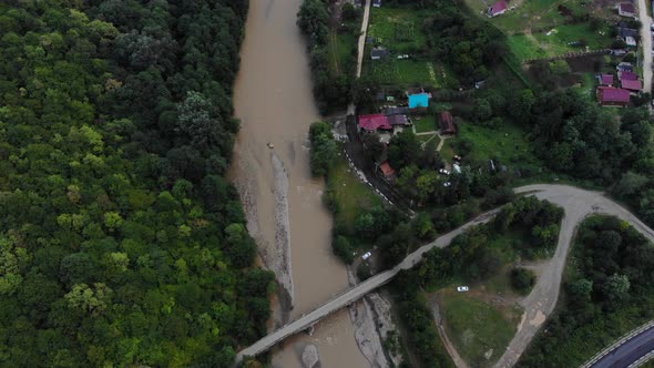 Flying over the bridge. View of the river from the air.