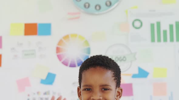 Kid as business executive gesturing in office 4k